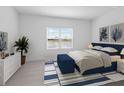 Spacious bedroom with a plush bed, large window, and a built-in bench at the foot of the bed at 18260 Vizcaya Ct, Venice, FL 34293