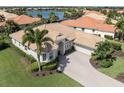 Luxury house with a tile roof and a large driveway at 145 Montelluna Dr, North Venice, FL 34275