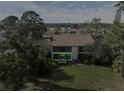 Condo with patio, overlooking a serene landscape at 886 Bird Bay Way # 206, Venice, FL 34285