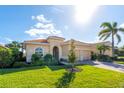 One-story house with two-car garage and landscaped lawn at 157 Palazzo Ct, North Venice, FL 34275