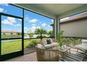 Relaxing screened patio overlooking tranquil lake view at 240 Teramo Way, Nokomis, FL 34275