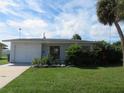 One story home with attached garage and landscaped yard at 268 Shamrock Blvd, Venice, FL 34293