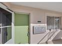 Exterior entryway with a light green door and mailboxes at 612 Guild Dr # 18, Venice, FL 34285