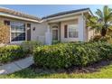 House exterior showcasing the front entrance with lush landscaping at 1622 Monarch Dr # 1622, Venice, FL 34293