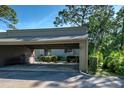 Private carport with covered parking space and additional storage at 201 Woodland Dr # 201, Osprey, FL 34229