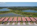 Aerial view of houses near a lake at 24273 Spartina Dr, Venice, FL 34293
