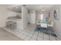 Open concept dining area with kitchen view at 1403 Gondola Park Dr # 1403Bd, Venice, FL 34292