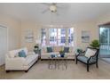 Living Room with comfy seating and large windows at 1403 Gondola Park Dr # 1403Bd, Venice, FL 34292