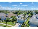 Bird's eye view of a light blue house in a quiet residential neighborhood at 12273 Stuart Dr, Venice, FL 34293