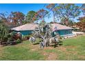 Single-story home with a large backyard, and ocean views at 2480 Alamander Ave, Englewood, FL 34223