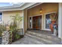 Inviting entryway with double doors and ornate details at 4024 Casey Key Rd, Nokomis, FL 34275