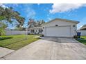 Single story home with attached garage and well-maintained lawn at 6738 Brentford Rd, Sarasota, FL 34241