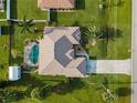 Bird's eye view of house, pool, and shed at 2112 S Chamberlain Blvd, North Port, FL 34286