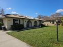 Single-story home with damaged roof and landscaping at 306 Signorelli Dr, Nokomis, FL 34275