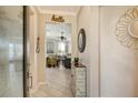 Bright and airy entryway with tile flooring and views into the living room at 19413 Rizzuto St, Venice, FL 34293