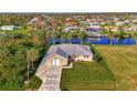 Waterfront home with private dock, lush landscaping, and tranquil canal views for relaxed coastal living at 4646 Fallon Cir, Port Charlotte, FL 33948