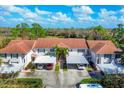 Aerial view showcasing the community's layout, carports, and proximity to the natural surroundings at 804 Montrose Dr # 103, Venice, FL 34293