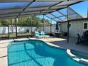 Relaxing swimming pool with a covered patio and comfortable seating at 516 Lehigh Rd, Venice, FL 34293