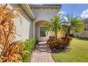 Brick-paved pathway leads to the front entrance of the home at 1222 Collier Pl, Venice, FL 34293