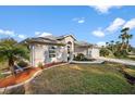 Single-story house with landscaped yard and attached garage at 4001 Tarpon Rd, Venice, FL 34293