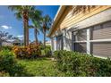 Landscaped backyard with lush greenery at 172 Southampton Pl # 346, Venice, FL 34293