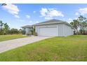Modern house exterior with paved driveway at 8559 Waldrep St, Port Charlotte, FL 33981