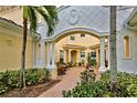 Relax in this inviting courtyard with brick pavement and lush greenery at 1704 Triano Cir # 1704, Venice, FL 34292