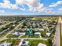 Aerial view showcasing the home's neighborhood setting at 2151 Broom Ct, Port Charlotte, FL 33952