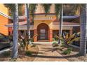 Building entrance with landscaped walkway at 147 Tampa E Ave # 202, Venice, FL 34285