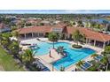 Aerial view of community pool and clubhouse at 11925 Bohemian Pl, Venice, FL 34293