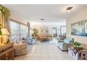 Bright and airy living room with tile floors at 1701 Boca Raton Ct, Punta Gorda, FL 33950