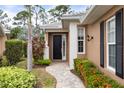 House exterior featuring a walkway and landscaping at 1805 Lancashire Dr, Venice, FL 34293