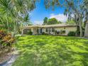 Charming single story home with lush landscaping at 2512 Regatta Dr, Sarasota, FL 34231