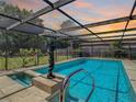 Inviting screened pool area with spa at 2512 Regatta Dr, Sarasota, FL 34231