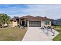 Attractive single-story home with a brown tile roof and attached garage at 3390 Dover Dr, Punta Gorda, FL 33983