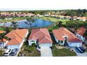 Community view with lake and houses at 4378 Summertree Rd, Venice, FL 34293