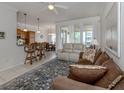 Bright living room with comfy sofas and access to the dining area at 900 San Lino Cir # 922, Venice, FL 34292