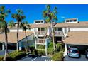 Two-story condo with balconies, parking, and palm trees at 1040 Bird Bay Way #283 Bld 40 # 283, Venice, FL 34293