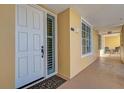 Condo hallway with exterior door and access to patio at 147 Tampa Ave # 303, Venice, FL 34285