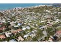 A serene view of the beach and neighborhood from above at 510 Harbor S Dr, Venice, FL 34285