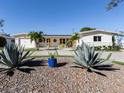 A single Gathering home featuring lush landscaping, lovely rock features, and fresh paint at 510 Harbor S Dr, Venice, FL 34285
