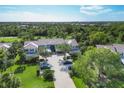 An aerial shot showing mature trees surrounding the condos and community features at 815 Montrose Dr # 103, Venice, FL 34293