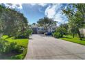 Paved driveway and well-maintained landscaping provide ample parking and curb appeal at 815 Montrose Dr # 103, Venice, FL 34293
