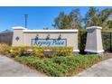 Entrance to the Keyway Place community with lush landscaping at 9920 Sheltering Spruce St, Englewood, FL 34223