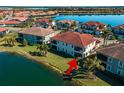 Back view of a townhome with private patio overlooking the lake at 117 Porta Vecchio Bnd # 101, Nokomis, FL 34275