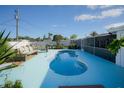 Inviting kidney-shaped pool with light blue deck at 126 Venice East Blvd, Venice, FL 34293