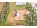 Birds eye view of the home, showcasing the roofline, backyard layout, and proximity to surrounding natural features at 1439 Strada D Argento, Venice, FL 34292