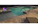 Relaxing backyard pool and spa with paver deck and lounge chair for enjoying the Florida sunshine at 169 N Cayman Isles Blvd, Englewood, FL 34223