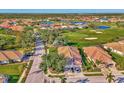 Aerial view showing home's location in a golf course community at 4665 Whispering Oaks Dr, North Port, FL 34287