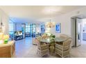 Bright dining area with table and chairs, view to living room at 612 Bird Bay S Dr # 114, Venice, FL 34285
